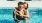 a man and woman hugging in a pool